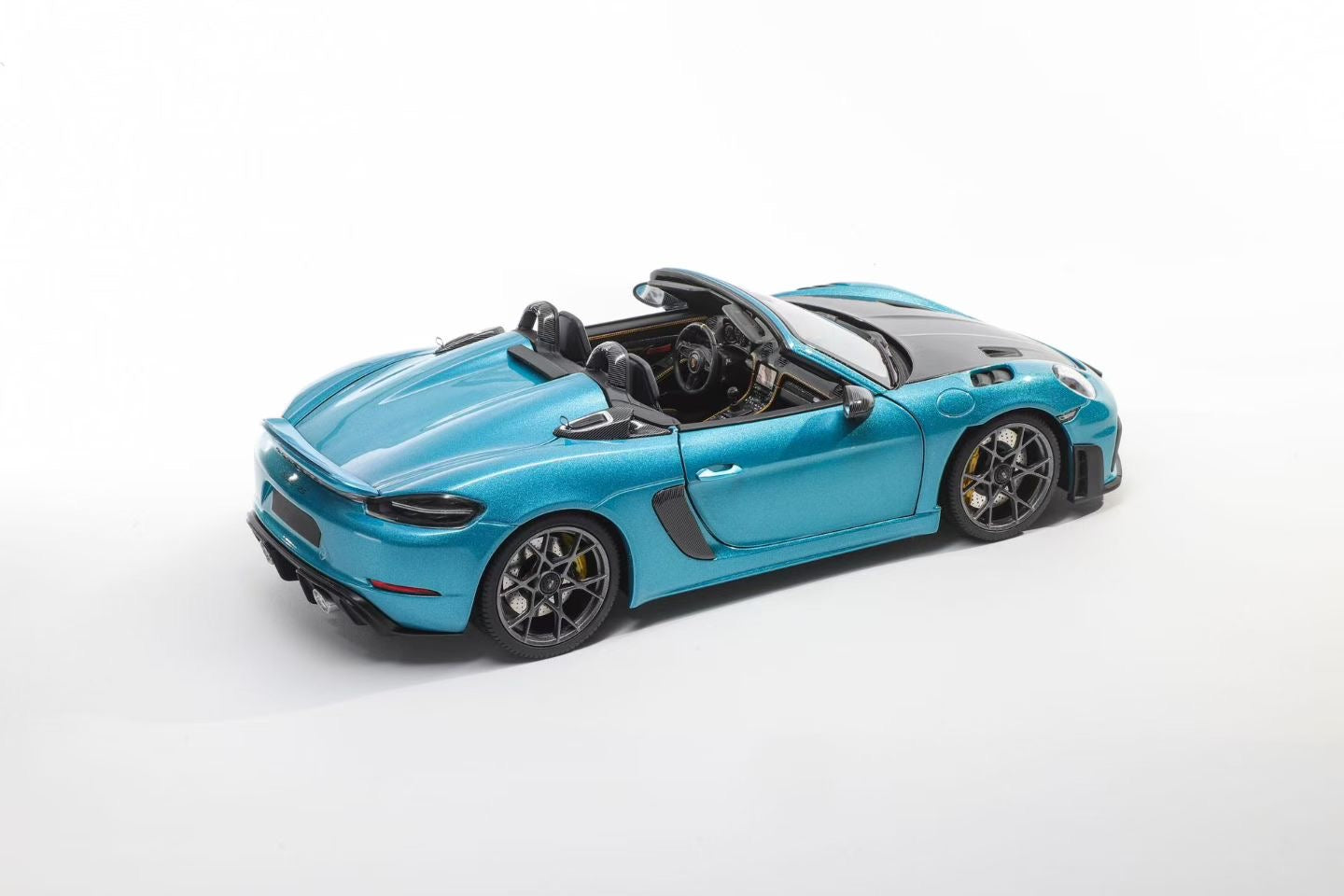 The Minichamps 1/18 Porsche 718 Sypder RS in Ipanema Blue is now available! Featuring numerous improvements over the standard model, the custom model comes in a gift box and is limited to just 300 units.